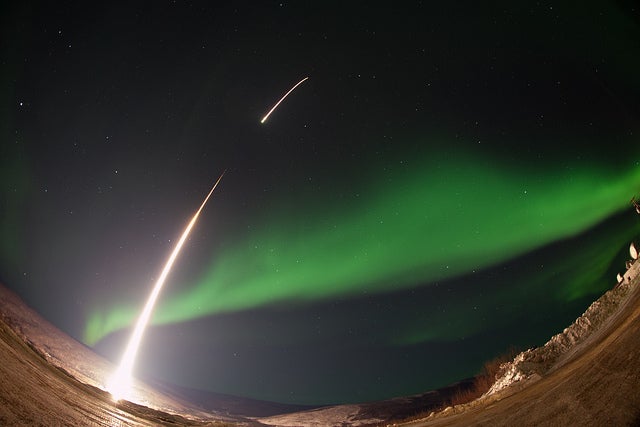 A NASA Rocket Soars Into an Emerald Aurora