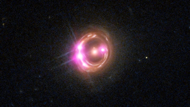 Distant supermassive black hole spins at half the speed of light