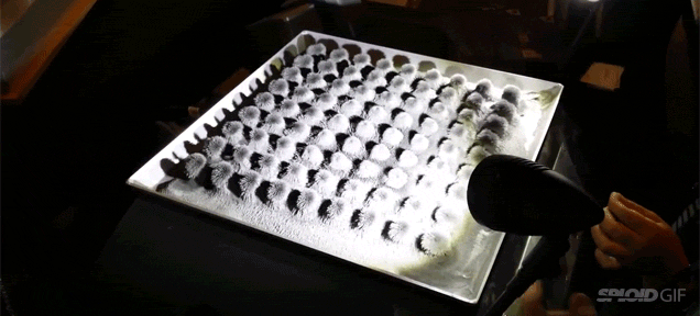 Magnetized iron dust moves in crazy patterns with the music