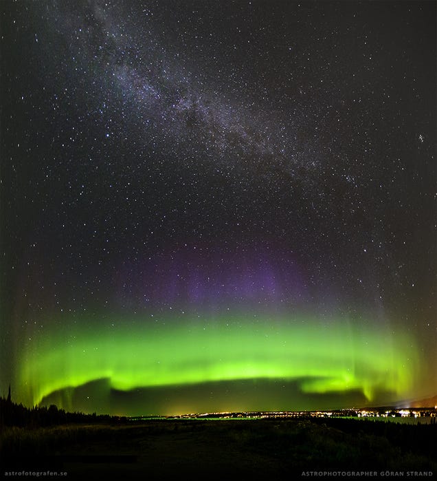 Incredible photo of the Milky Way rising over green and violet auroras