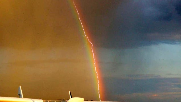 Amazing photo shows lightning striking an airliner flying in a rainbow