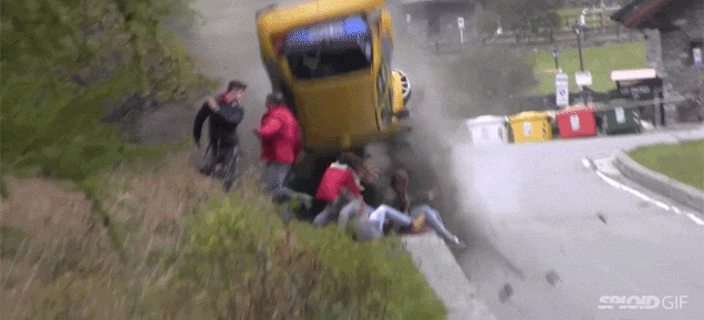 Insane car crash somehow barely avoids hitting a group of bystanders