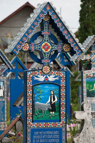 In the world's most cheerful cemetery, the tombstones are brightly painted and jokes are written on the graves