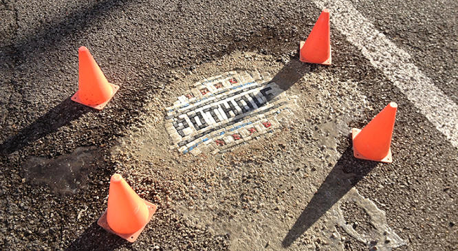 There's a Joker Repairing Chicago's Horrible Potholes With Mosaics
