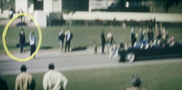 Why Conspiracy Theorists Are So Obsessed With JFK's "Umbrella Man"