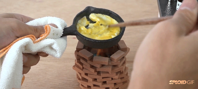 Cute miniature kitchen allows you to cook tiny breakfast on tiny pans