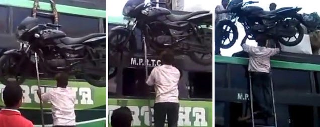 Guy with super strength puts a motorcycle on top of a bus with his head