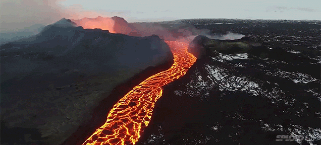 Incredible drone footage of a flowing lava river