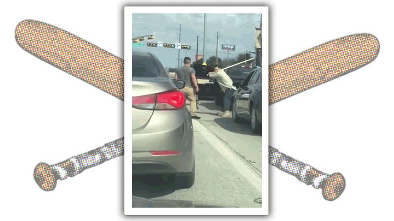 Two Men Have Epic Bat-Stick Fight At Intersection