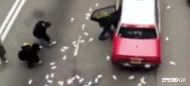 Armored truck spills $4.5 million on road, everyone rushes to grab it
