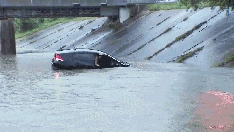 Watch This Annoyed Reporter Rescue A Man From A Sinking Car On Live TV
