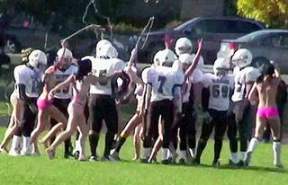 Cheerleaders Show School Spirit Through Streaking