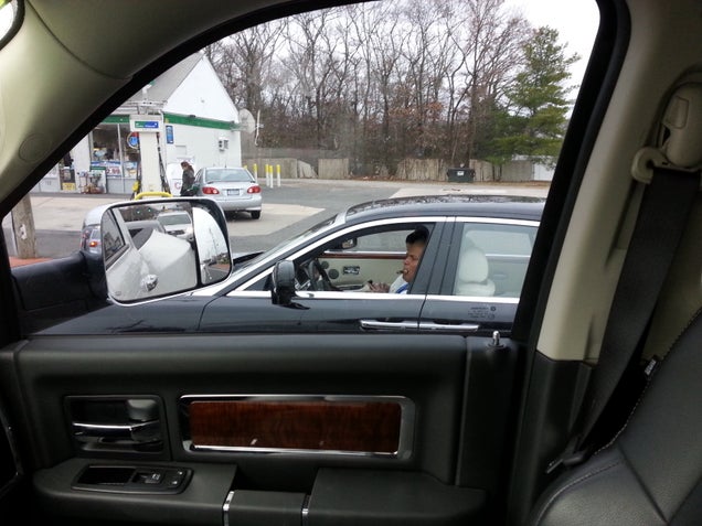 Steamin' a cigar in the Rolls like a gotdamn boss!