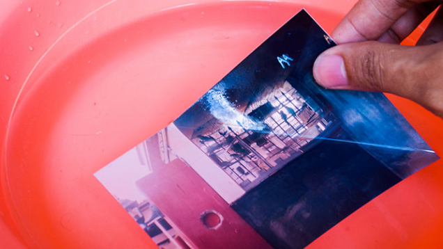 Save Sticky Photographs by Soaking Them in Lukewarm Water
