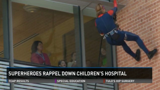 SWAT Team Members in Superhero Costumes Go Rappelling for Sick Kids