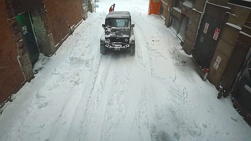Why Be Snowed In When You Can Snowboard Through NYC Behind A Jeep Wrangler?