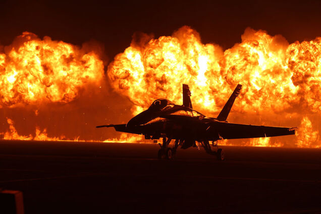 Spectacular photo of an F-18 against a huge wall of fire