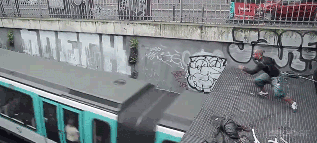 Lunatic leaps on top of moving metro train as it emerges from tunnel