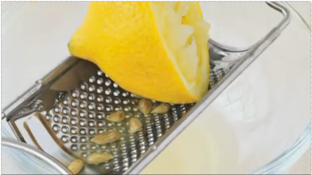 Squeeze Citrus Over a Grater to Catch Seeds