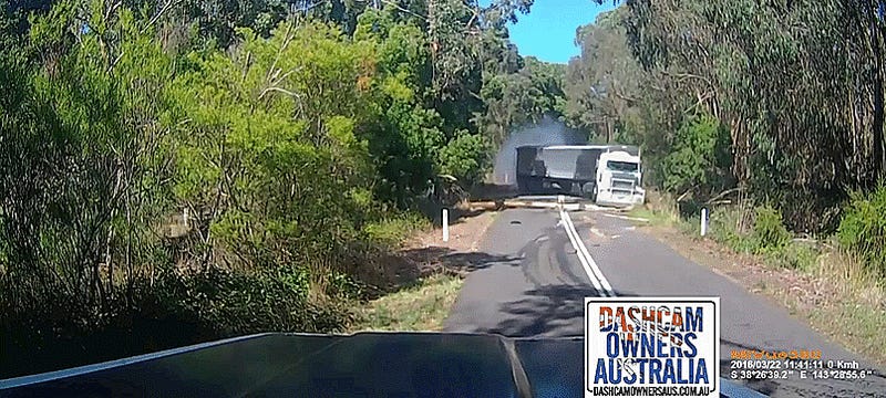 Big Rig Spectacularly Fails To Avoid Tree In The Road