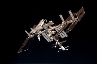 The first-ever photos of a space shuttle docked at the International Space Station