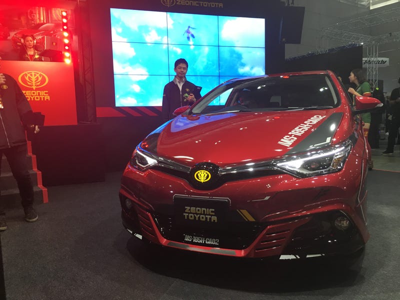 This Gundam-Themed Toyota Has Its Own Costumed DJ For Auto Shows