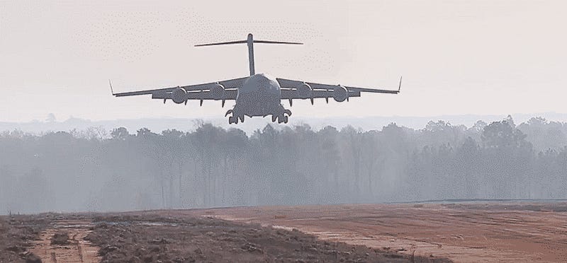 Watch This C-17 Plop Down On A Dirt Airstrip And Cough Up Two Apaches Like A Boss