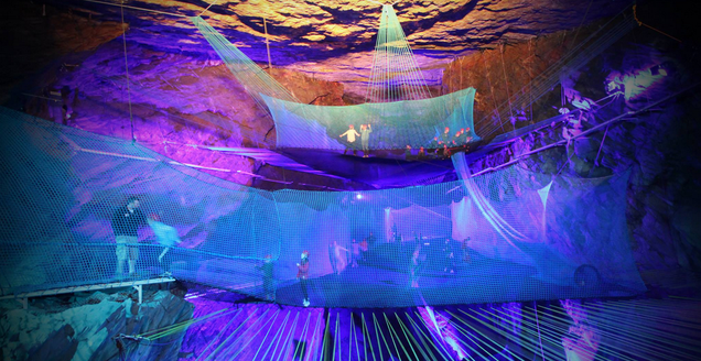 The Coolest Trampoline On Earth Is Suspended Inside a Huge Cavern