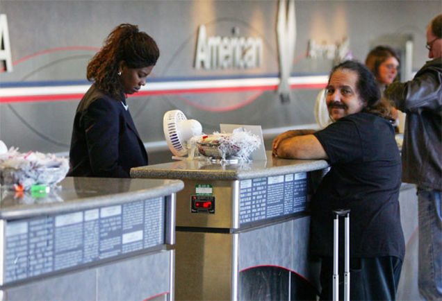 Ron Jeremy Gets Cozy With Airplane Ticket Counter