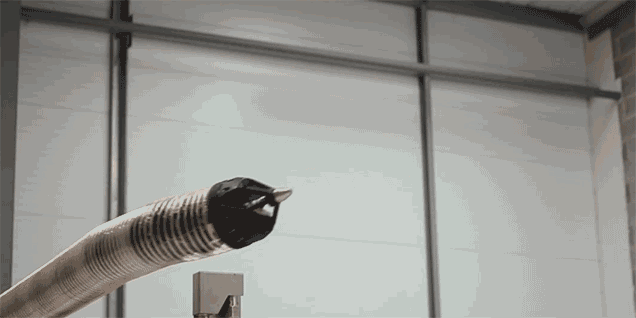 Tesla's Building Robotic Snakes That Emerge From Walls to Charge Cars
