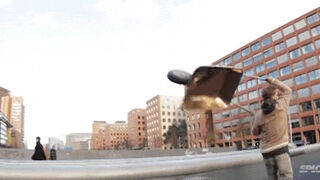 Guy using wheel barrow to do skateboard tricks is hilariously absurd