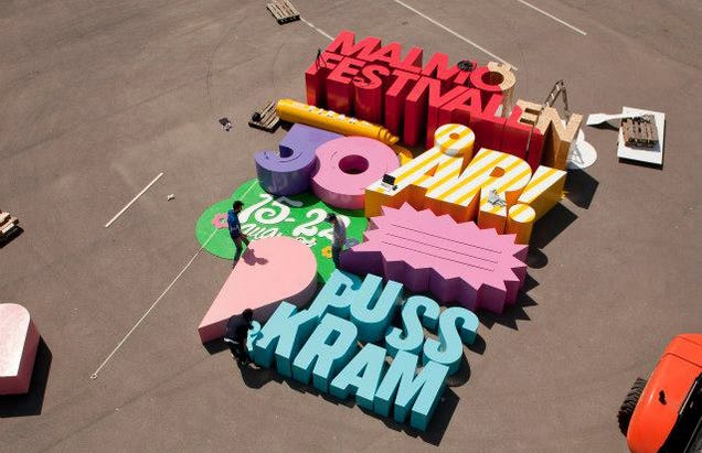 Cool 3D poster is made with letters so big that they can crush a human