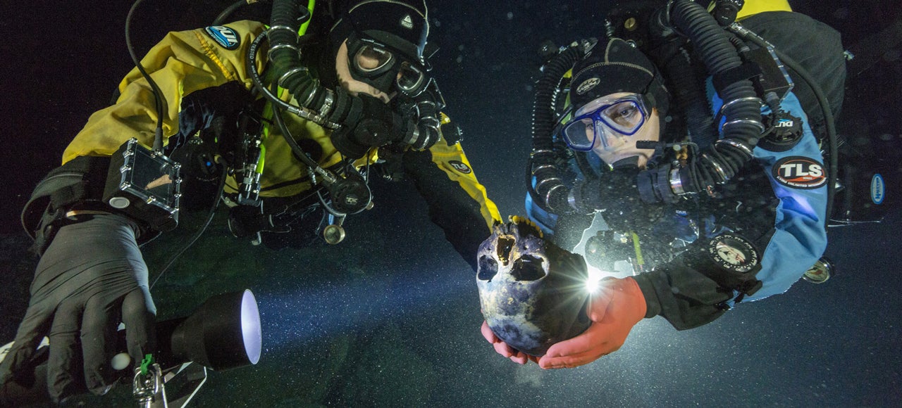This Diver Is Cradling a 12,000-Year-Old Skull in an Underwater Cave
