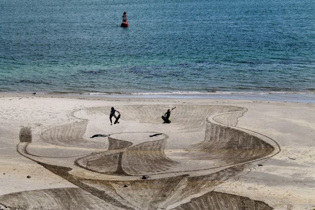 These 3D sand drawings create fun trippy illusions on the beach