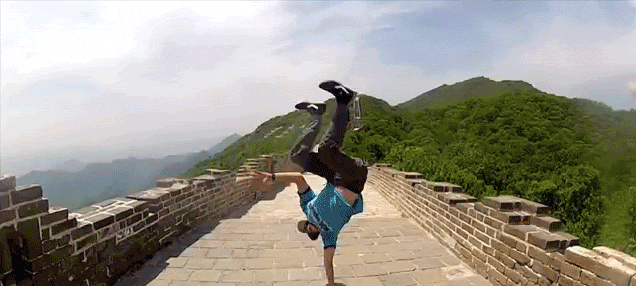 Awesome guy does awesome hand stands in awesome places on awesome trip