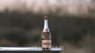 Uncorking A Champagne Bottle With A Huge Sniper Rifle