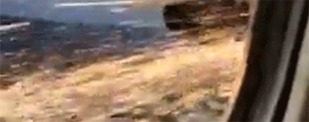 Passenger films one of his airplane's engines on fire