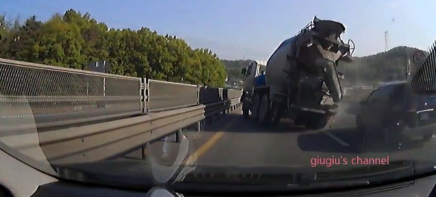 Cement truck narrowly avoids destroying every car on the highway