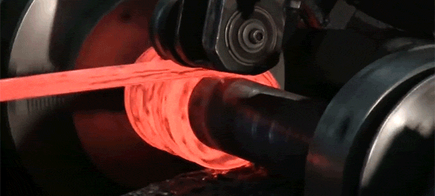 Watch a Red Hot Metal Rod Get Wound Up Into a Coil Spring
