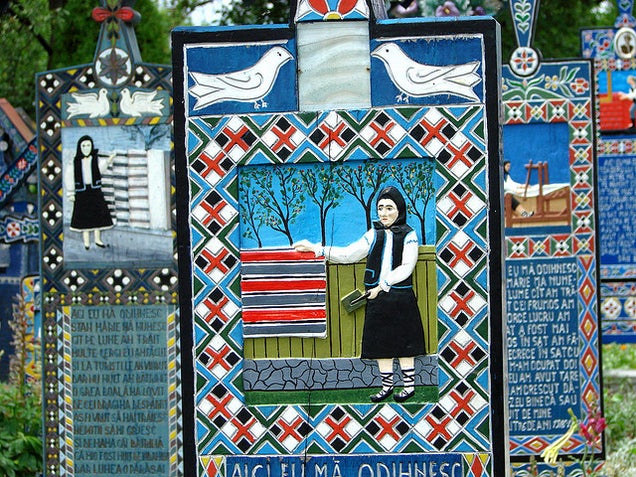 In the world's most cheerful cemetery, the tombstones are brightly painted and jokes are written on the graves