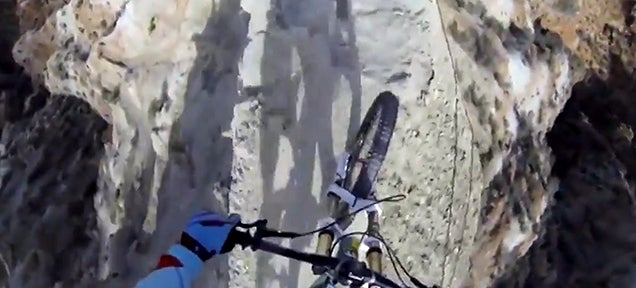 Watching this guy mountain bike down a rocky narrow cliff is insanity