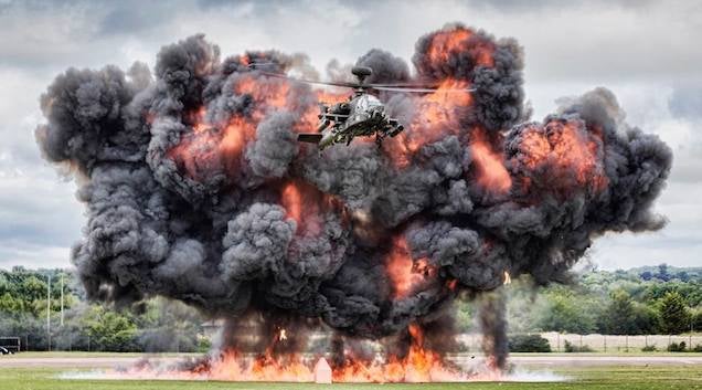 Here's an Apache flying away from a gigantic smoke monster explosion