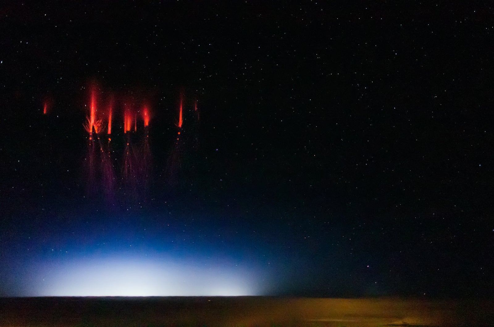 Ethereal Photos Capture Rare Red Lightning Phenomenon