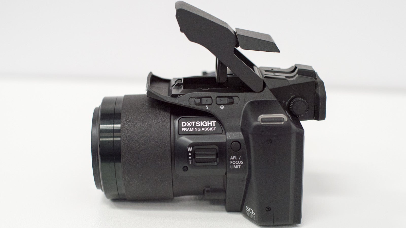 OLYMPUS SP-100 Is a 50X Superzoom Camera With a Red Dot Sight Like a Gun