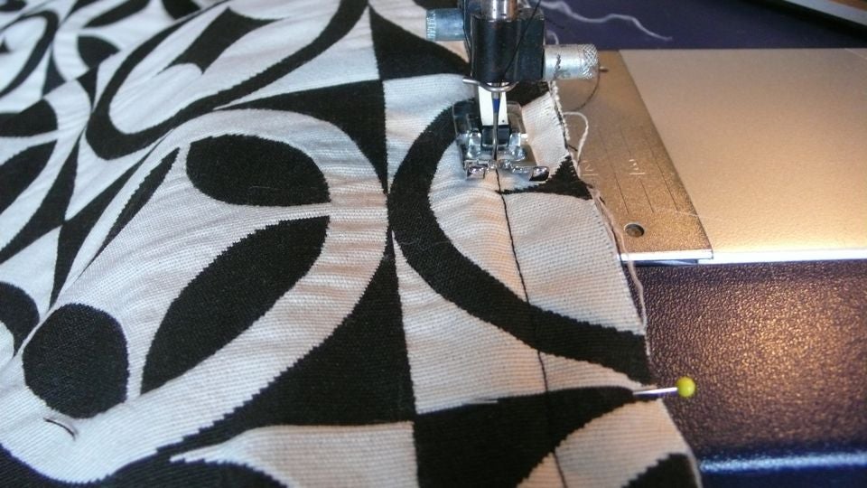 How To Ditch Your Boring Throw Pillows For Something Cooler