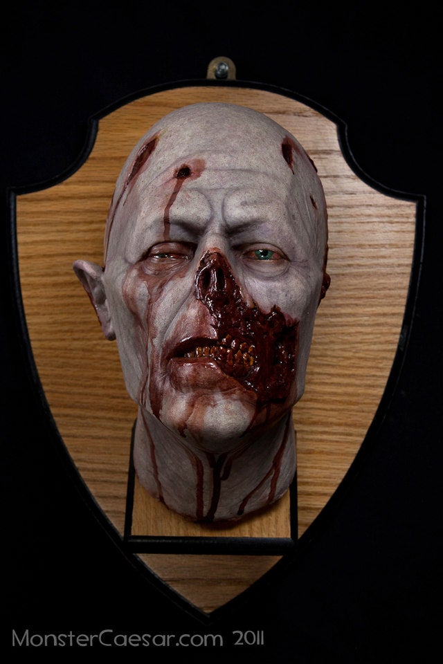 Mounted zombie head shows that you are a decorator of undead distinction