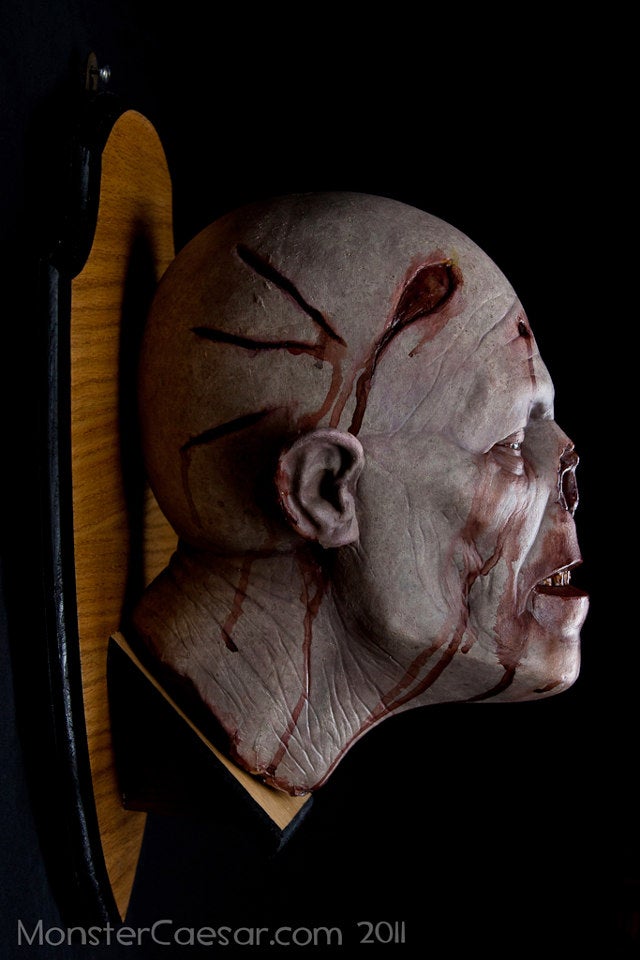 Mounted zombie head shows that you are a decorator of undead distinction