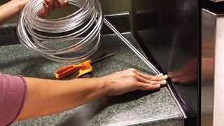 Use Simple Plastic Tubing To Seal The Gap Between Kitchen