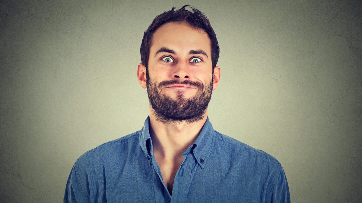 How to Stop Smiling Awkwardly in Pictures