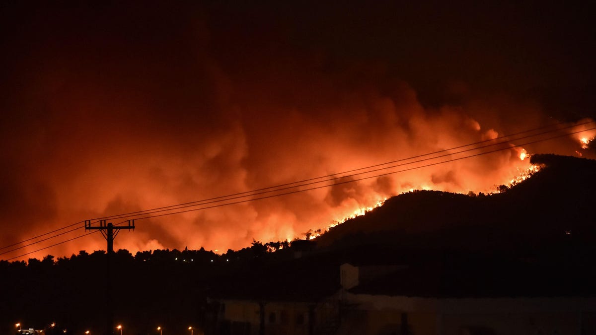 Wildfires Continue to Rage Across Greece, Cutting Island in Half and Forcing Tho..